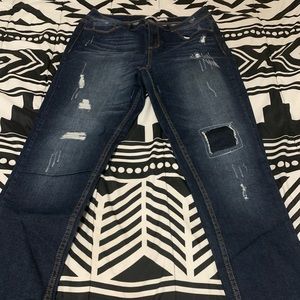 Distressed blue jeans